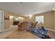A finished basement with tv, large sofa, and an area with weights and exercise equipment at 5370 S Union Way, Littleton, CO 80127