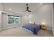 Bright bedroom with a ceiling fan, a large window and neutral carpeting at 5370 S Union Way, Littleton, CO 80127
