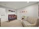 Cozy bedroom with a crib and couch at 5370 S Union Way, Littleton, CO 80127