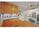 Kitchen featuring wood cabinets, granite countertops and hardwood floors at 5370 S Union Way, Littleton, CO 80127