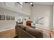 Spacious living room with high ceilings, a piano and view to dining room and kitchen at 5370 S Union Way, Littleton, CO 80127
