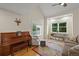 Cozy living room with large windows, hardwood floors, and comfortable seating at 5370 S Union Way, Littleton, CO 80127