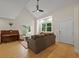 Living room with vaulted ceilings, large windows, a fan and hardwood floors at 5370 S Union Way, Littleton, CO 80127