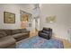 Comfortable living room with a large area rug and an open staircase at 5370 S Union Way, Littleton, CO 80127