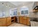 Kitchen with granite countertops and stainless steel appliances at 6055 W Warren Pl, Lakewood, CO 80227