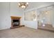 Open living room with fireplace and high ceilings at 6055 W Warren Pl, Lakewood, CO 80227