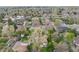 Expansive aerial view of a neighborhood with mature trees, well-maintained lawns, and diverse home styles at 3015 Pierce St, Wheat Ridge, CO 80214