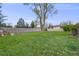 Expansive backyard with lush green grass, surrounded by a wooden fence, providing a private and spacious outdoor area for enjoyment at 3015 Pierce St, Wheat Ridge, CO 80214