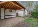 Charming backyard patio with wooden beams, providing a perfect outdoor space for relaxation and entertaining at 3015 Pierce St, Wheat Ridge, CO 80214