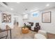 Finished basement with cozy seating, and plenty of natural light from windows at 3015 Pierce St, Wheat Ridge, CO 80214