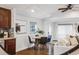 Cozy dining area with hardwood floors, and an open view of the living room at 3015 Pierce St, Wheat Ridge, CO 80214