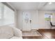 Bright foyer with new floors, wainscotting, and a charming front door at 3015 Pierce St, Wheat Ridge, CO 80214