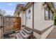 Charming front entrance with a decorative door, sconces and a tidy walkway at 3015 Pierce St, Wheat Ridge, CO 80214