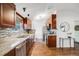 Spacious kitchen featuring stainless steel appliances, granite countertops, and ample storage at 3015 Pierce St, Wheat Ridge, CO 80214