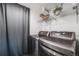Efficient laundry room with modern washer and dryer, providing convenience and functionality for everyday chores at 3015 Pierce St, Wheat Ridge, CO 80214