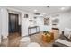 Cozy living room with stylish decor, comfortable seating, and seamless flow into adjacent bedroom, creating a warm and inviting space at 3015 Pierce St, Wheat Ridge, CO 80214