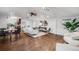 Bright living room with hardwood floors, modern furniture, and a ceiling fan at 3015 Pierce St, Wheat Ridge, CO 80214