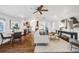 Open-concept living room with dining area and modern furnishings at 3015 Pierce St, Wheat Ridge, CO 80214