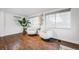 Bright and airy sitting area with hardwood floors and comfortable chairs at 3015 Pierce St, Wheat Ridge, CO 80214