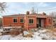 Home has a large backyard and brick exterior with a picnic table and grill for outdoor entertaining at 950 Jasmine St, Denver, CO 80220