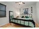 Bedroom features hardwood floors, large mirror, ceiling fan and ample natural light from the window at 950 Jasmine St, Denver, CO 80220