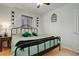 Cozy bedroom features hardwood floors, ceiling fan and ample natural light from the window at 950 Jasmine St, Denver, CO 80220