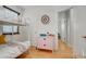 Bedroom features wood floors, neutral paint, ceiling fan, a bunk bed, and a dresser at 950 Jasmine St, Denver, CO 80220