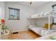 Bedroom features wood floors, neutral paint, ceiling fan, and a bunk bed at 950 Jasmine St, Denver, CO 80220