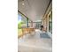 Covered outdoor patio with string lights and a grill, perfect for outdoor gatherings at 5455 E Iowa Ave, Denver, CO 80222