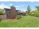 Lush backyard with a well-maintained lawn, creating a serene outdoor space at 5455 E Iowa Ave, Denver, CO 80222