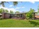 Spacious backyard with mature trees, a patio, perfect for outdoor activities at 5455 E Iowa Ave, Denver, CO 80222