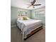 Bedroom with ample natural light, carpeted floors, and a ceiling fan at 5455 E Iowa Ave, Denver, CO 80222