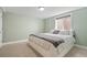 Cozy bedroom featuring a comfortable queen bed and lots of natural light at 5455 E Iowa Ave, Denver, CO 80222