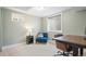 Well-lit home office featuring a desk and comfortable chair, great for remote work at 5455 E Iowa Ave, Denver, CO 80222