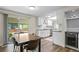 Bright kitchen with white cabinetry, subway tile backsplash, and sliding door access to outdoor dining at 5455 E Iowa Ave, Denver, CO 80222