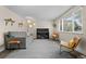 Bright living area featuring a piano, modern furniture, and stylish decor at 5455 E Iowa Ave, Denver, CO 80222
