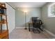 Office space with a desk, chair, lamp, and shelving, perfect for remote work or study at 5455 E Iowa Ave, Denver, CO 80222