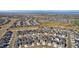 Wide aerial view of neighborhood showcasing the community, streets, and surrounding area at 806 Flora View Dr, Erie, CO 80516