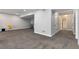 Spacious finished basement with carpet, neutral paint, and an open layout at 806 Flora View Dr, Erie, CO 80516