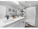 Bathroom featuring dual vanity, modern fixtures, and a shower-tub combination at 806 Flora View Dr, Erie, CO 80516