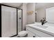 Modern bathroom featuring a sleek, glass-enclosed shower and contemporary fixtures at 806 Flora View Dr, Erie, CO 80516