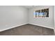 Cozy bedroom features soft carpet and a window offering natural light and views at 806 Flora View Dr, Erie, CO 80516