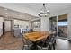 Dining area features an open floor plan and modern chandelier at 806 Flora View Dr, Erie, CO 80516