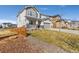 Charming two-story home with a manicured lawn and a three car garage at 806 Flora View Dr, Erie, CO 80516