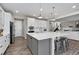 Open kitchen features a large island with seating and stainless steel appliances at 806 Flora View Dr, Erie, CO 80516