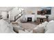 Cozy living room featuring a fireplace, plush seating, and contemporary decor at 806 Flora View Dr, Erie, CO 80516