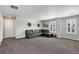 Cozy living room with a comfortable sectional sofa and natural light at 806 Flora View Dr, Erie, CO 80516