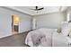 Main bedroom features an ensuite bathroom and a ceiling fan at 806 Flora View Dr, Erie, CO 80516
