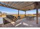Outdoor dining with built-in grill under a wood pergola with shade and sun at 806 Flora View Dr, Erie, CO 80516