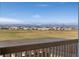 Scenic mountain views seen from the porch overlooking a community of single Gathering homes at 806 Flora View Dr, Erie, CO 80516